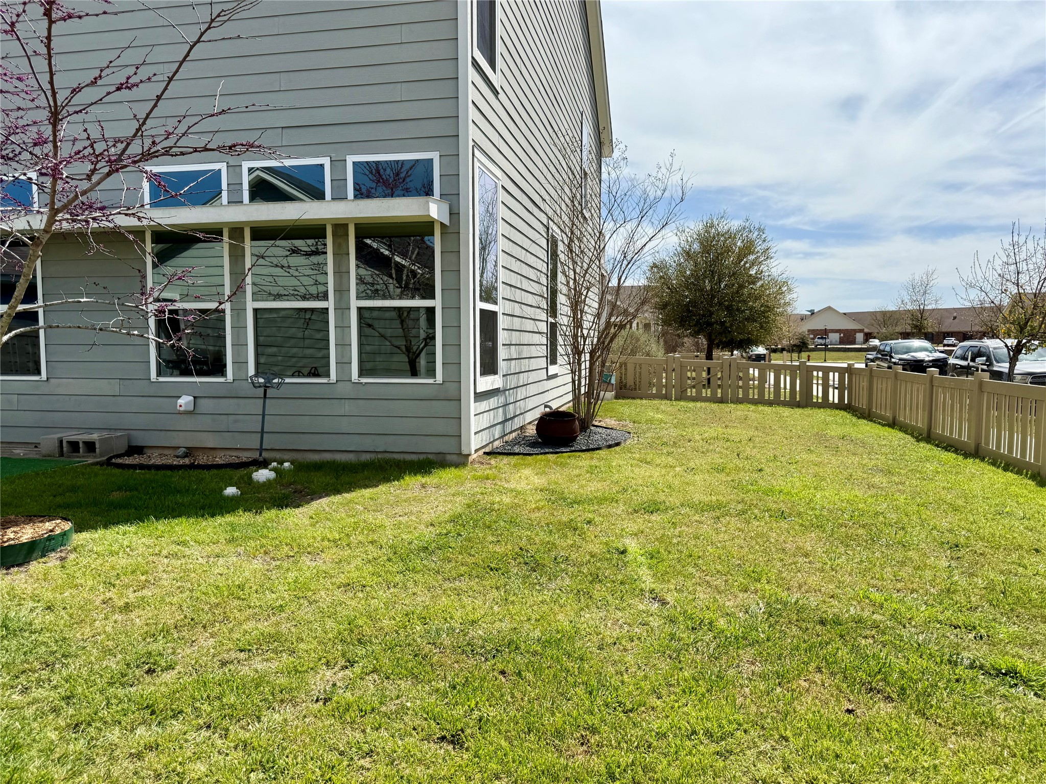 1293 Nevarez Kyle, TX 78640 - Photo 26 of 31 View of home's exterior featuring a yard and fence.