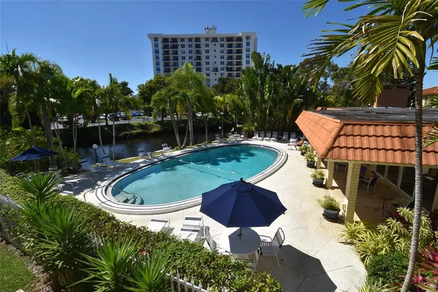 a backyard of a house with yard and outdoor seating