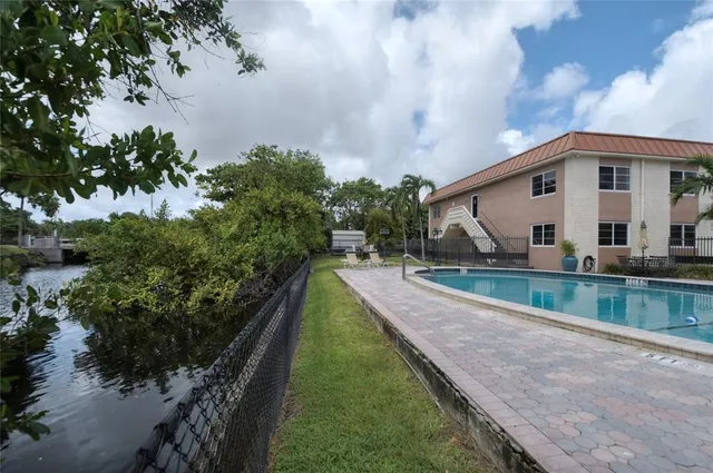 a view of house with a yard