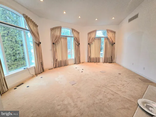 a view of a livingroom with wooden floor and a window