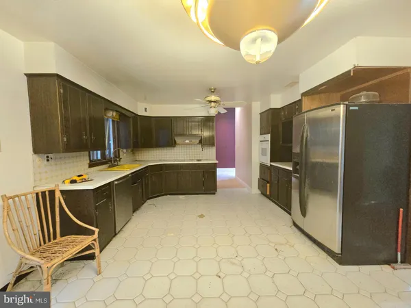 a kitchen with stainless steel appliances a refrigerator and a stove