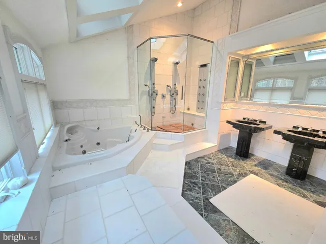 a bathroom with a bathtub and a shower