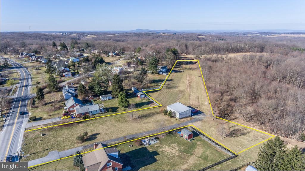27008 Ridge Road Damascus, MD 20872 - Photo 1 of 14 an aerial view of residential houses with outdoor space