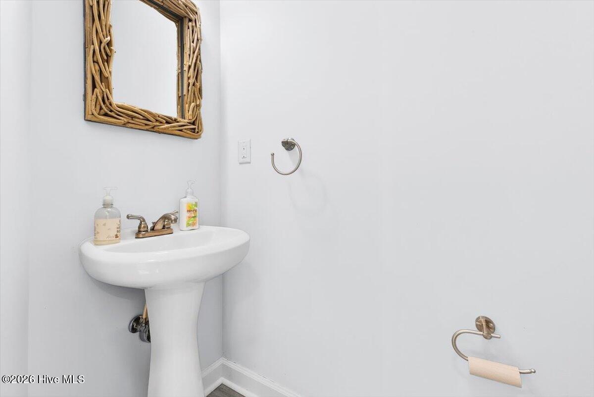 7640 Front Street, Unit 2 Sunset Beach, NC 28468 - Photo 16 of 46 Powder Room