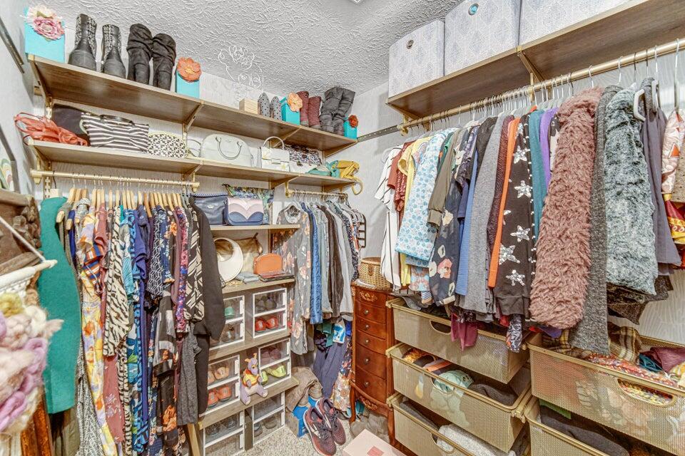 7960 East 173rd Avenue Hebron, IN 46341 - Photo 11 of 36 a view of walk in closet with clothes and shoes