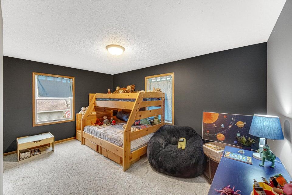 7960 East 173rd Avenue Hebron, IN 46341 - Photo 12 of 36 a bedroom with furniture and a window