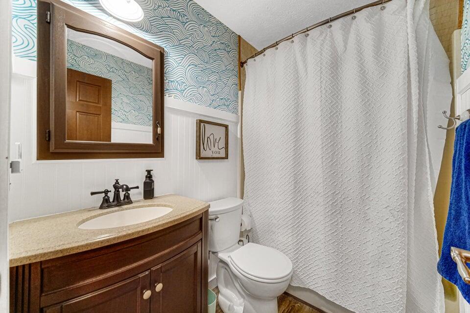 7960 East 173rd Avenue Hebron, IN 46341 - Photo 14 of 36 a bathroom with a granite countertop sink and a toilet