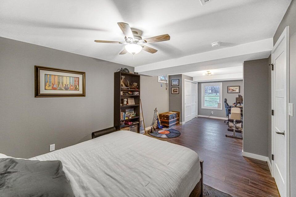 7960 East 173rd Avenue Hebron, IN 46341 - Photo 15 of 36 a bed room with a bed and a chandelier