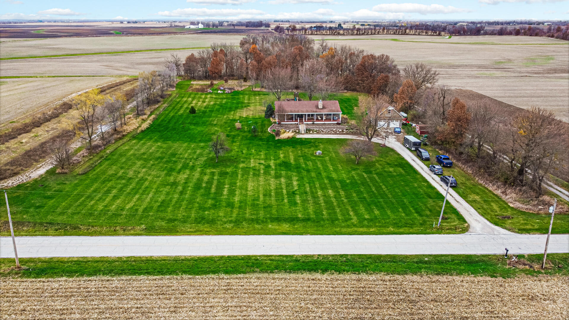 7960 East 173rd Avenue Hebron, IN 46341 - Photo 2 of 36 a view of a lake with a big yard