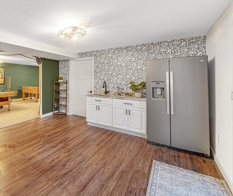 7960 East 173rd Avenue Hebron, IN 46341 - Photo 21 of 36 a kitchen with stainless steel appliances granite countertop a refrigerator and a stove top oven