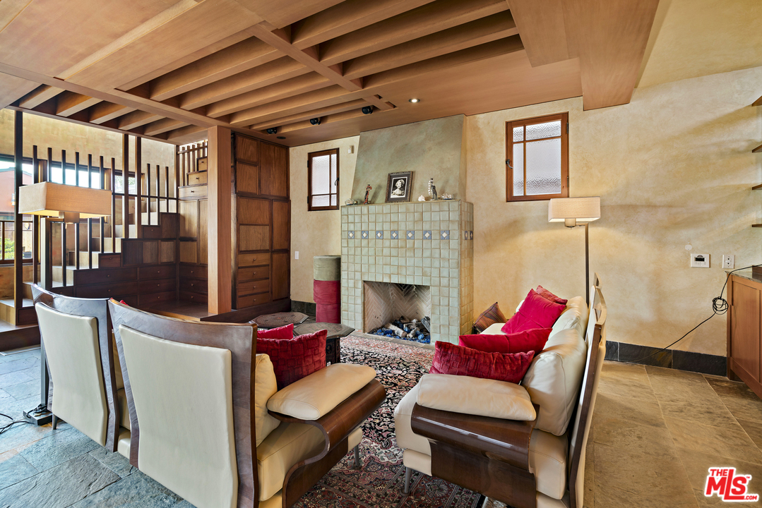 23746 Malibu Road Malibu, CA 90265 - Photo 2 of 46 a living room with furniture a fireplace and a table