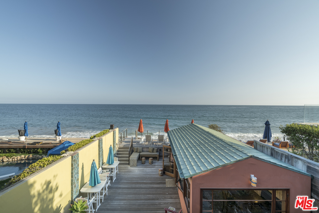 23746 Malibu Road Malibu, CA 90265 - Photo 11 of 46 a view of a terrace with chairs