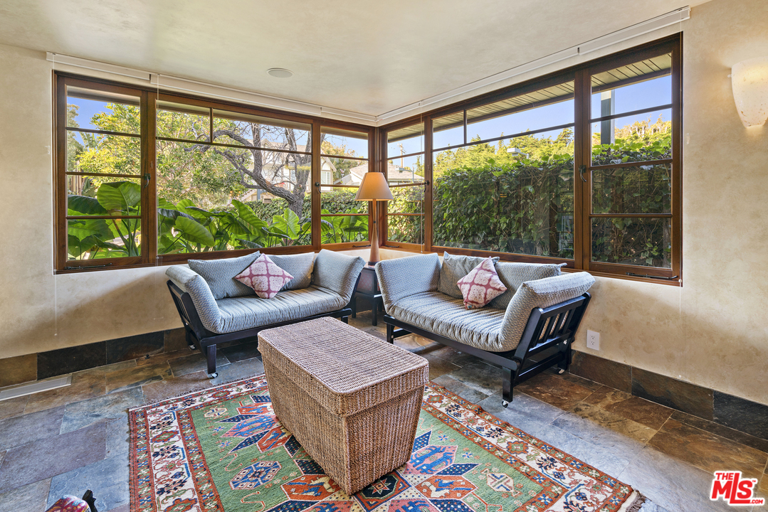23746 Malibu Road Malibu, CA 90265 - Photo 25 of 46 a living room with furniture and a large window