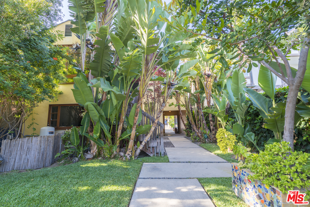 23746 Malibu Road Malibu, CA 90265 - Photo 31 of 46 a view of backyard with table and chairs and potted plants