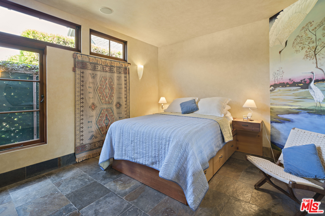 23746 Malibu Road Malibu, CA 90265 - Photo 38 of 46 a bedroom with a bed and window