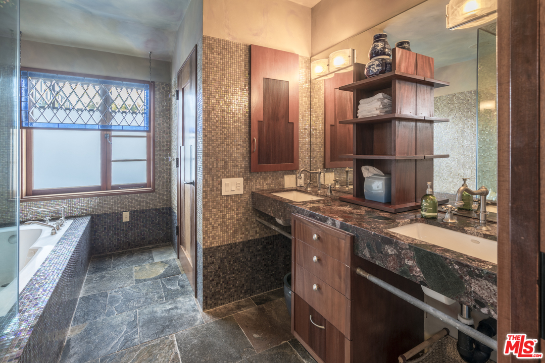23746 Malibu Road Malibu, CA 90265 - Photo 41 of 46 a kitchen with a sink and a stove top oven
