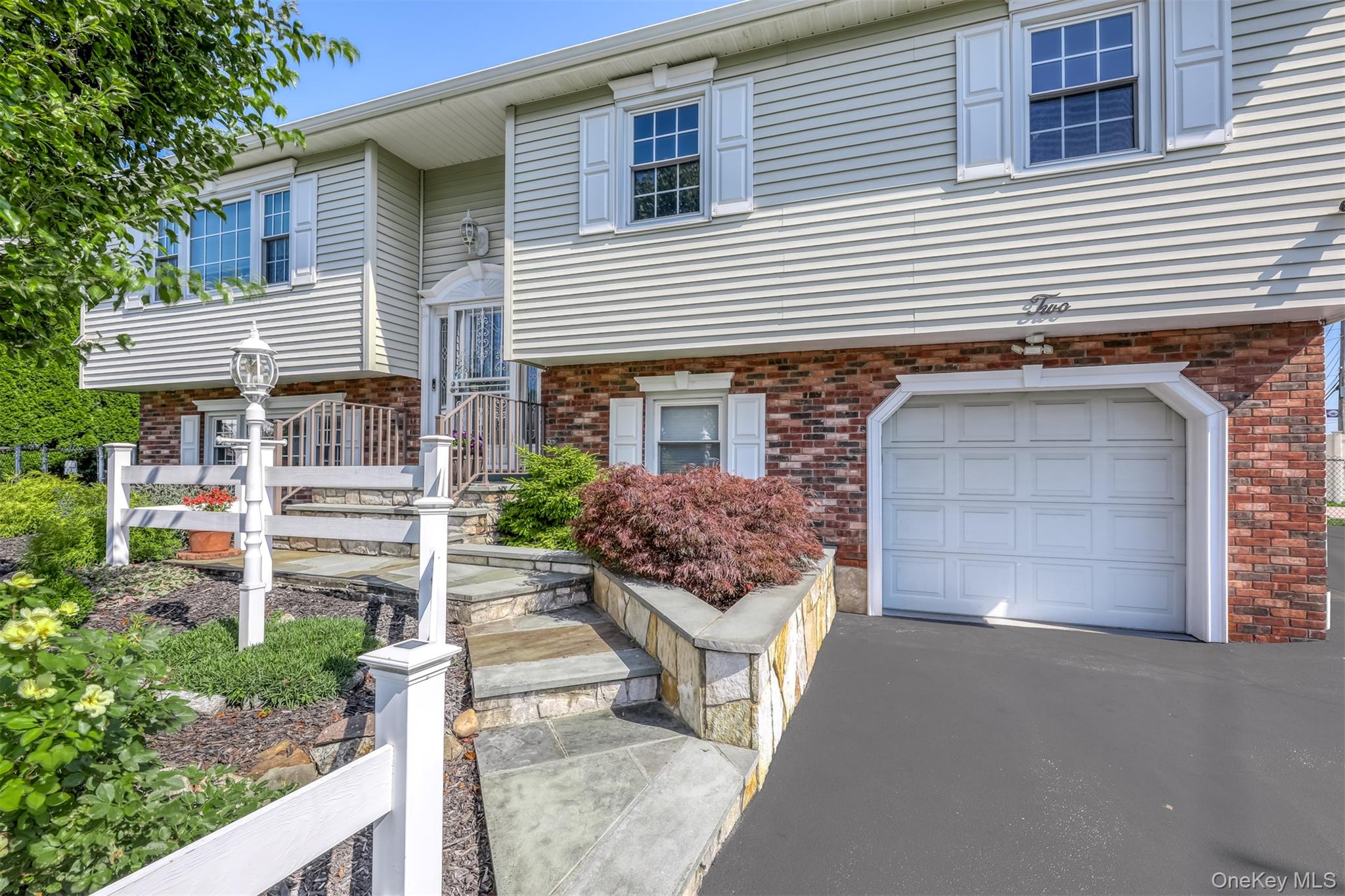 a front view of a house with a garage