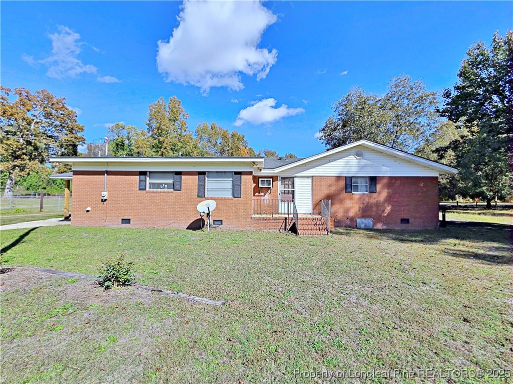 764 Old Vander Road Fayetteville, NC 28312 - Photo 26 of 50 a front view of a house with garden