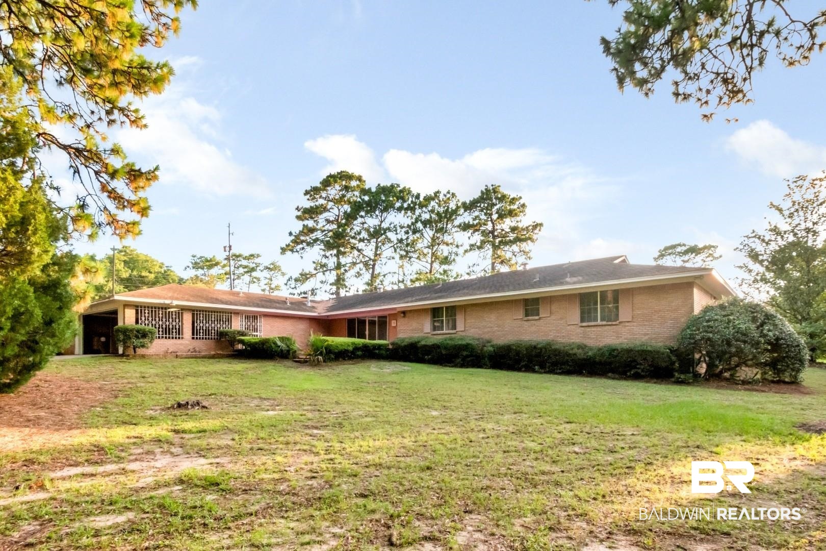 241 Suzanne Circle Mobile, AL 36608 - Photo 36 of 41 Back of house featuring a yard and brick siding
