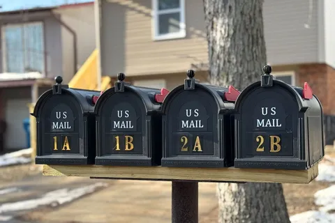 a view of a brick house with large windows