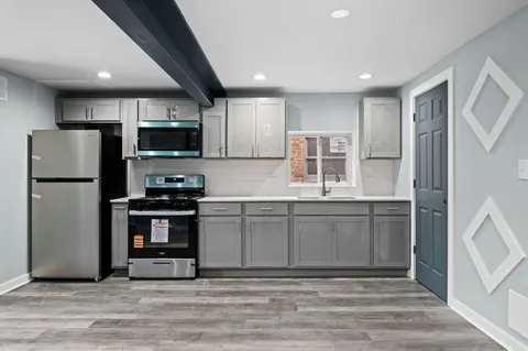 a white toilet sitting next to a bathroom sink