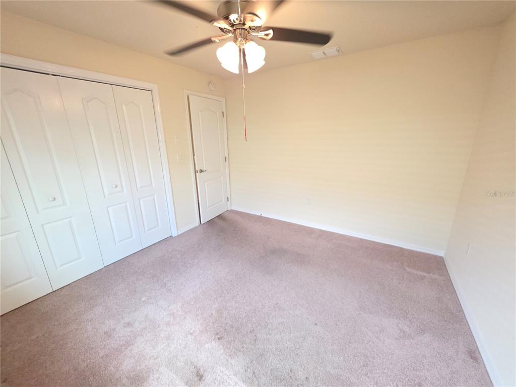 4284 High Ridge Avenue Spring Hill, FL 34609 - Photo 16 of 40 a view of an empty room and chandelier fan