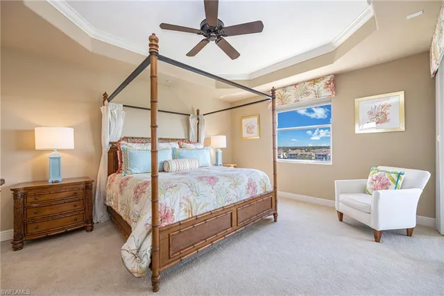 a bedroom with a bed a couch and a window