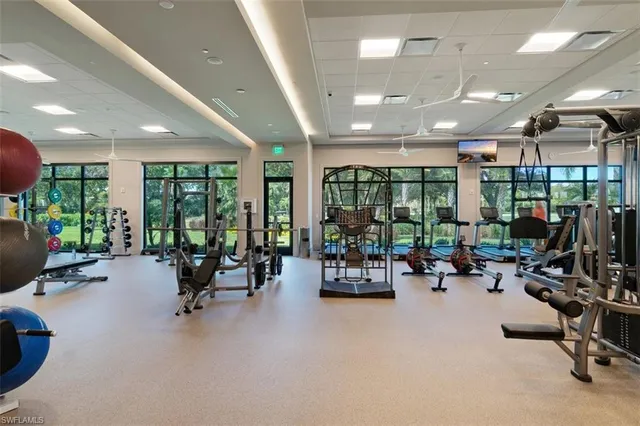 a dining room with furniture and a chandelier