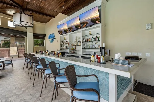 a view of a swimming pool with outdoor seating