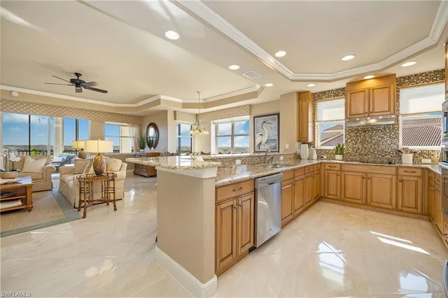 a large white kitchen with lots of counter top space