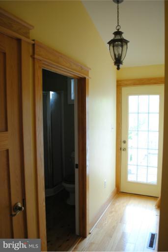 77 Forest Grove Road Amissville, VA 20106 - Photo 7 of 30 a view of empty room with windows and chandelier
