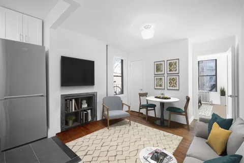 a living room with furniture fireplace and a flat screen tv