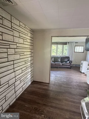 a view of livingroom with furniture and floor to ceiling window