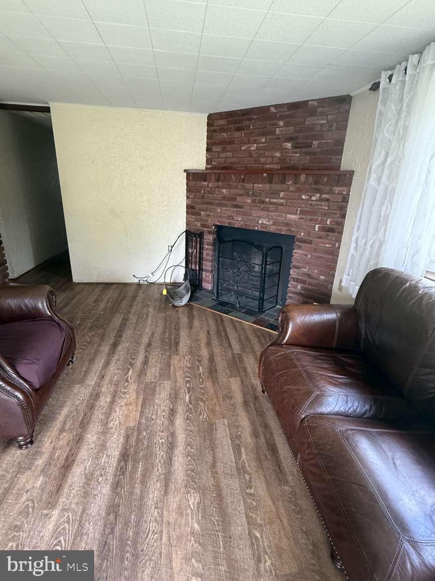 1839 Byberry Road Bensalem, PA 19020 - Photo 13 of 24 a living room with furniture and a fireplace