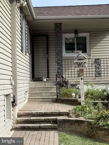 a front view of a house with a porch