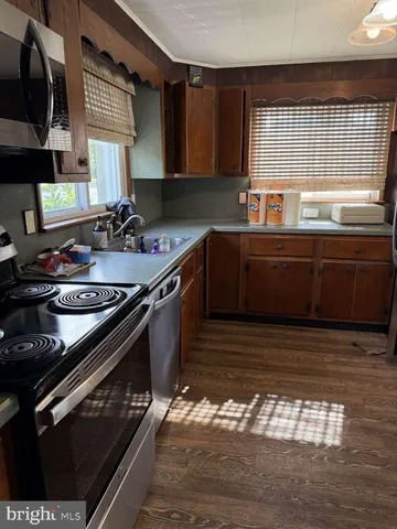 a kitchen with a stove and a sink