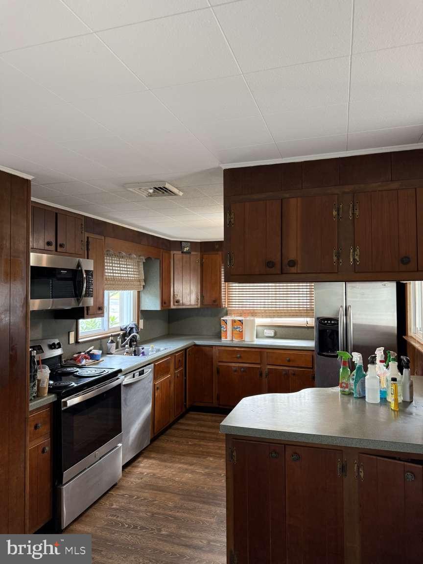1839 Byberry Road Bensalem, PA 19020 - Photo 9 of 24 a kitchen with kitchen island granite countertop a sink cabinets and stainless steel appliances