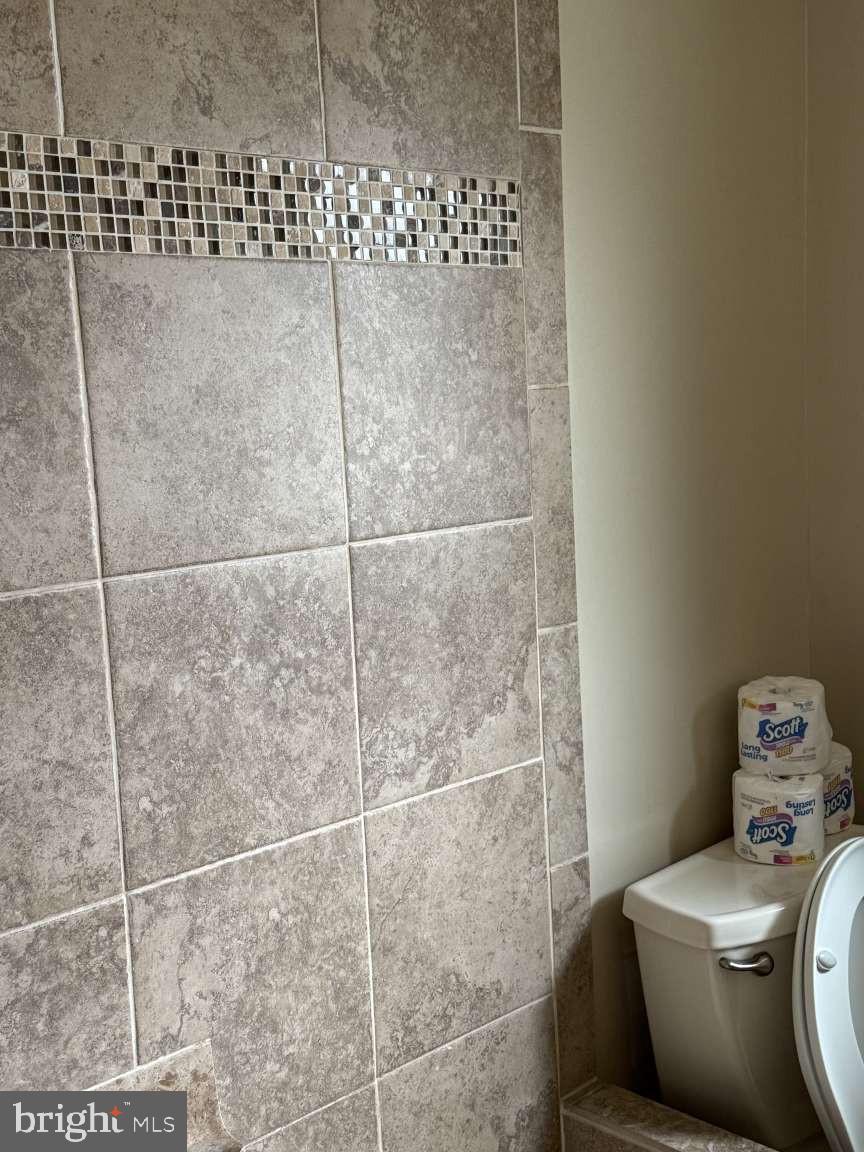 1839 Byberry Road Bensalem, PA 19020 - Photo 10 of 24 a bathroom with a toilet and shower