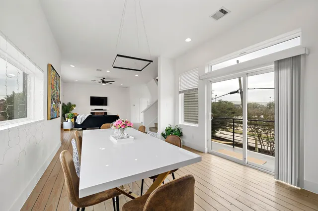 a view of a dining room with furniture window and wooden floor