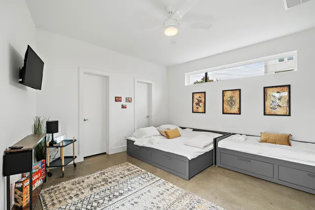 a bedroom with a bed and a couch