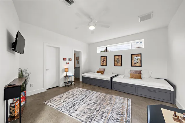 a living room with furniture and a rug