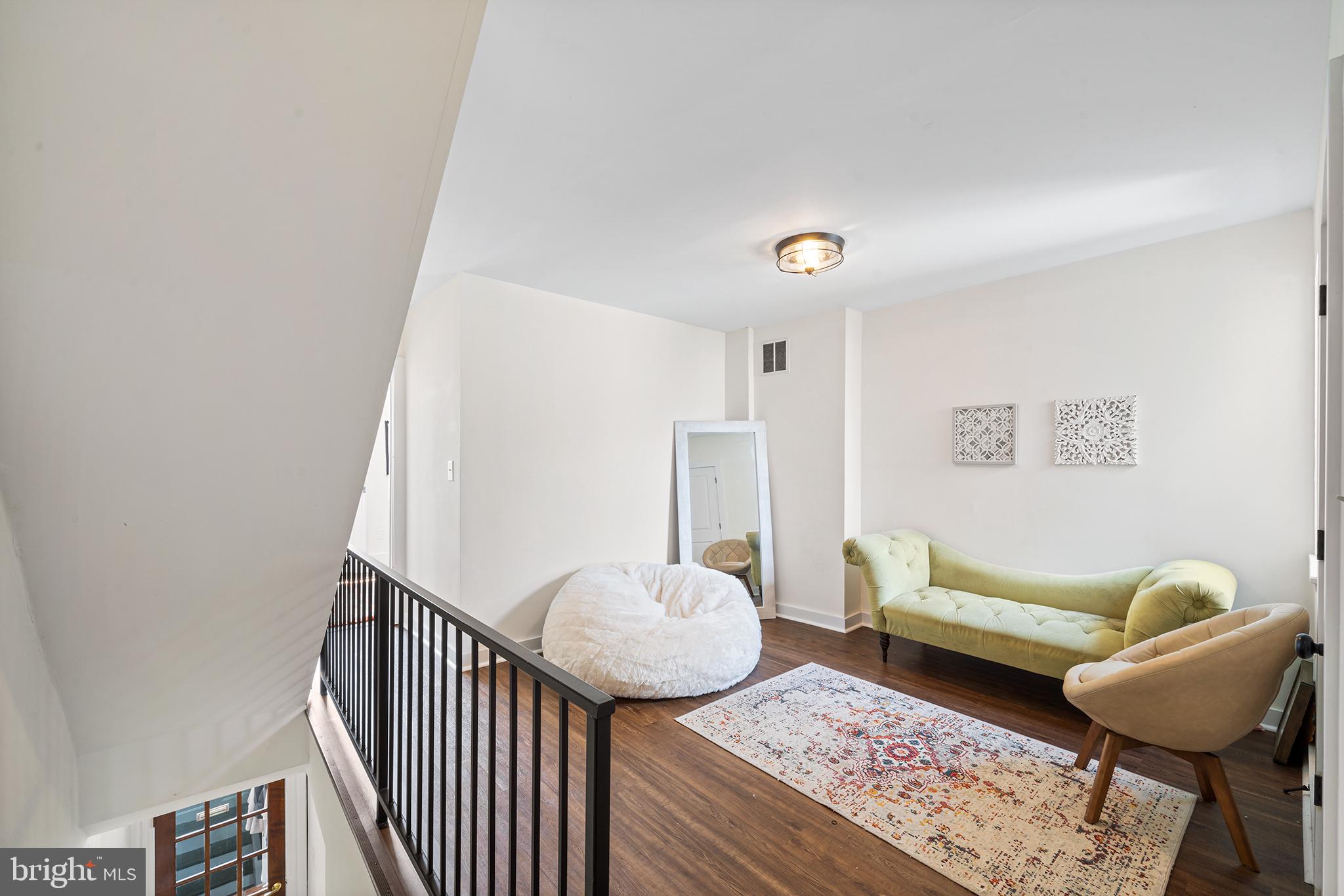 107 Master Street Philadelphia, PA 19122 - Photo 15 of 24 a living room with furniture and a rug