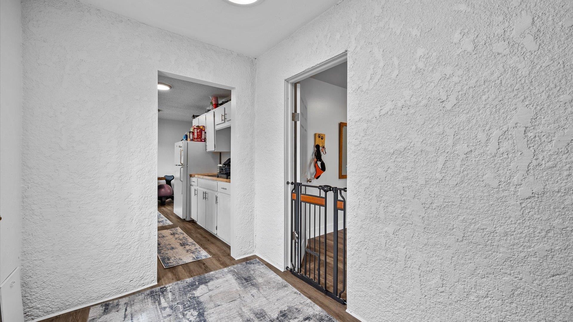 419 South Ash Street Fruita, CO 81521 - Photo 11 of 18 a view of a hallway with a room that has a car parked in front of it