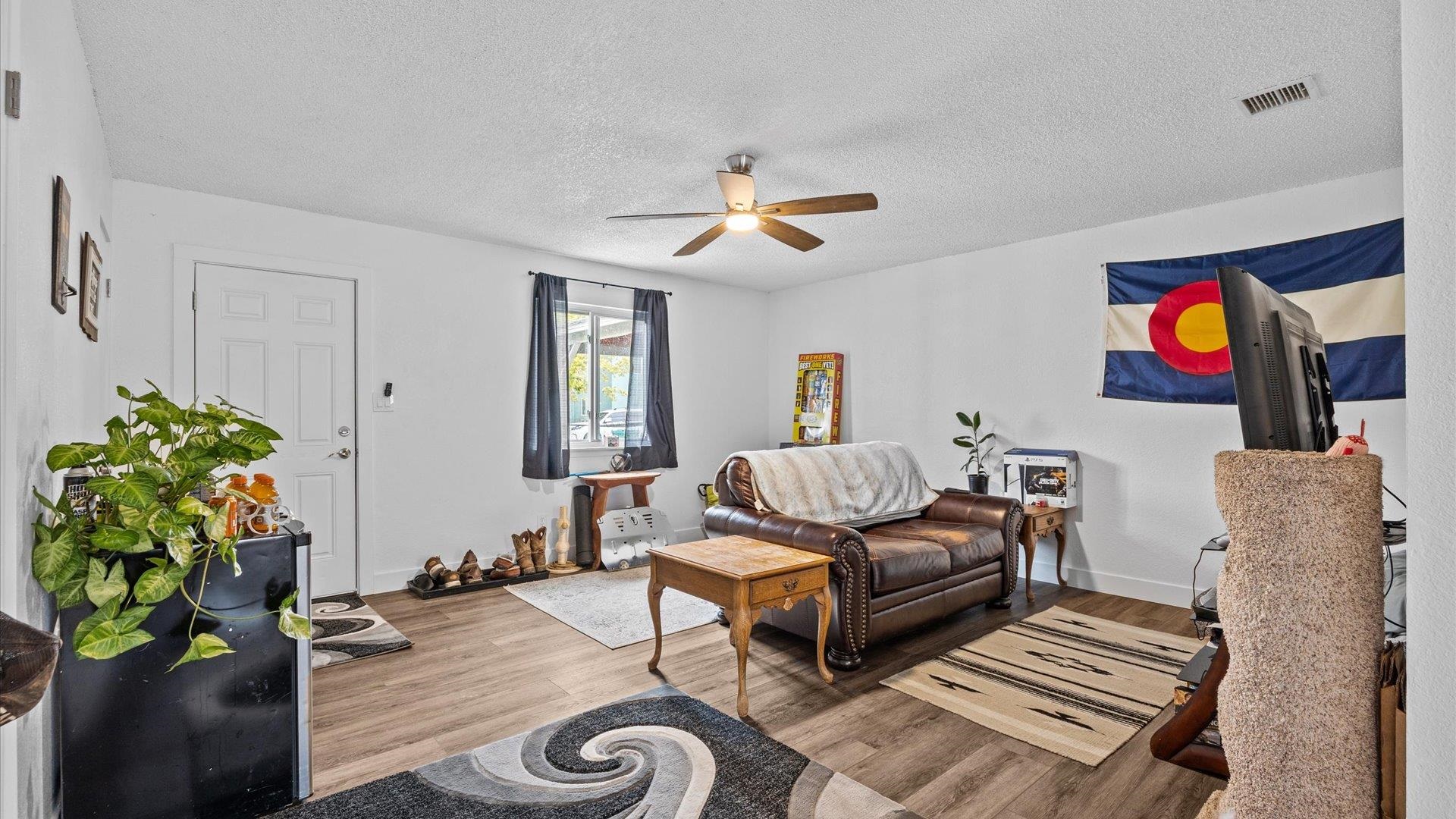 419 South Ash Street Fruita, CO 81521 - Photo 14 of 18 a living room with furniture and a flat screen tv