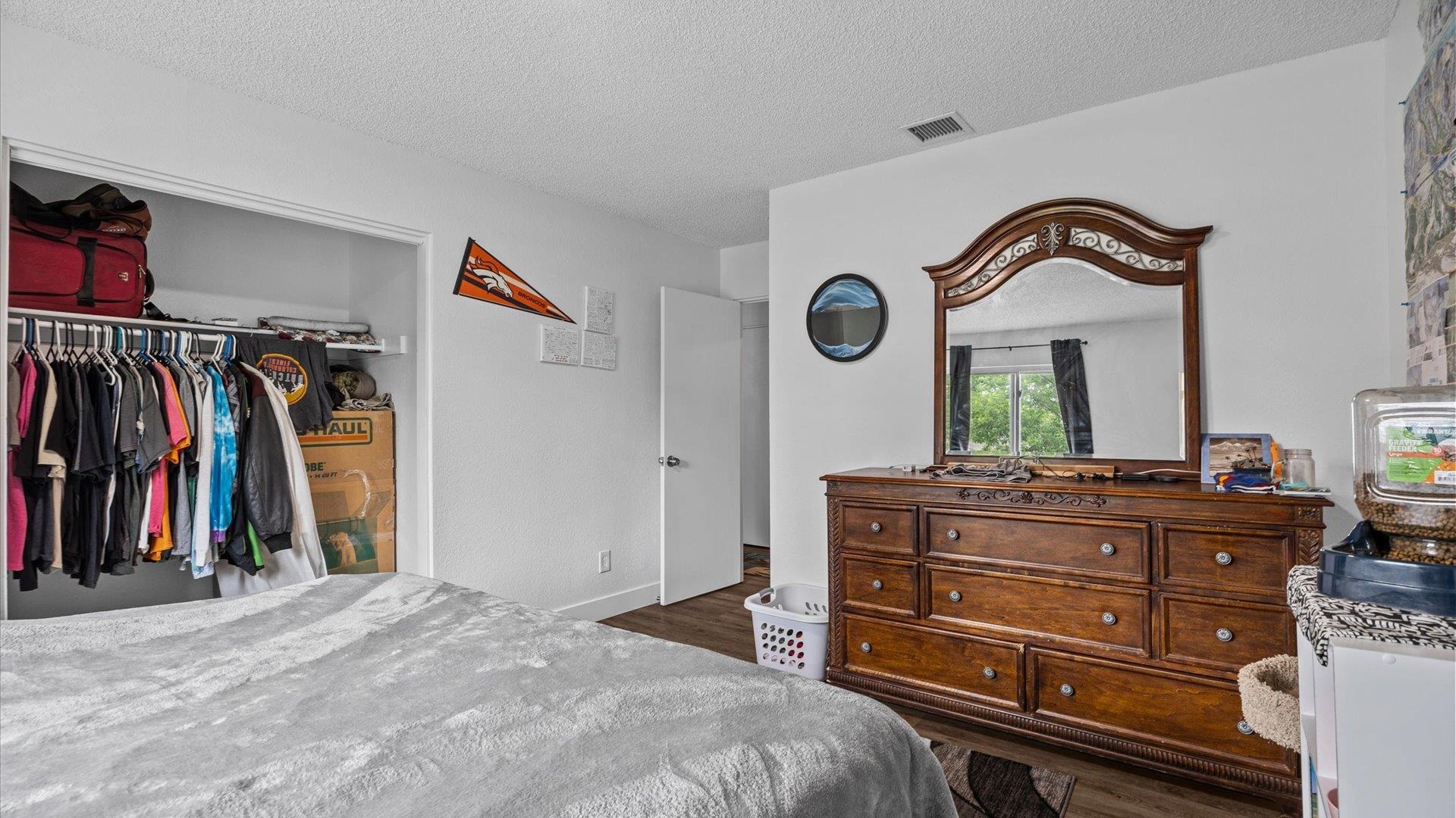419 South Ash Street Fruita, CO 81521 - Photo 7 of 18 a bed room with a bed and a mirror