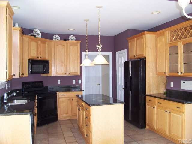 217 Challenge Road Raleigh, NC 27603 - Photo 2 of 12 Gourmet Kitchen w/granite countertops/lots of cabinets/walk-in pantry. Refrigerator conveys! Kitchen