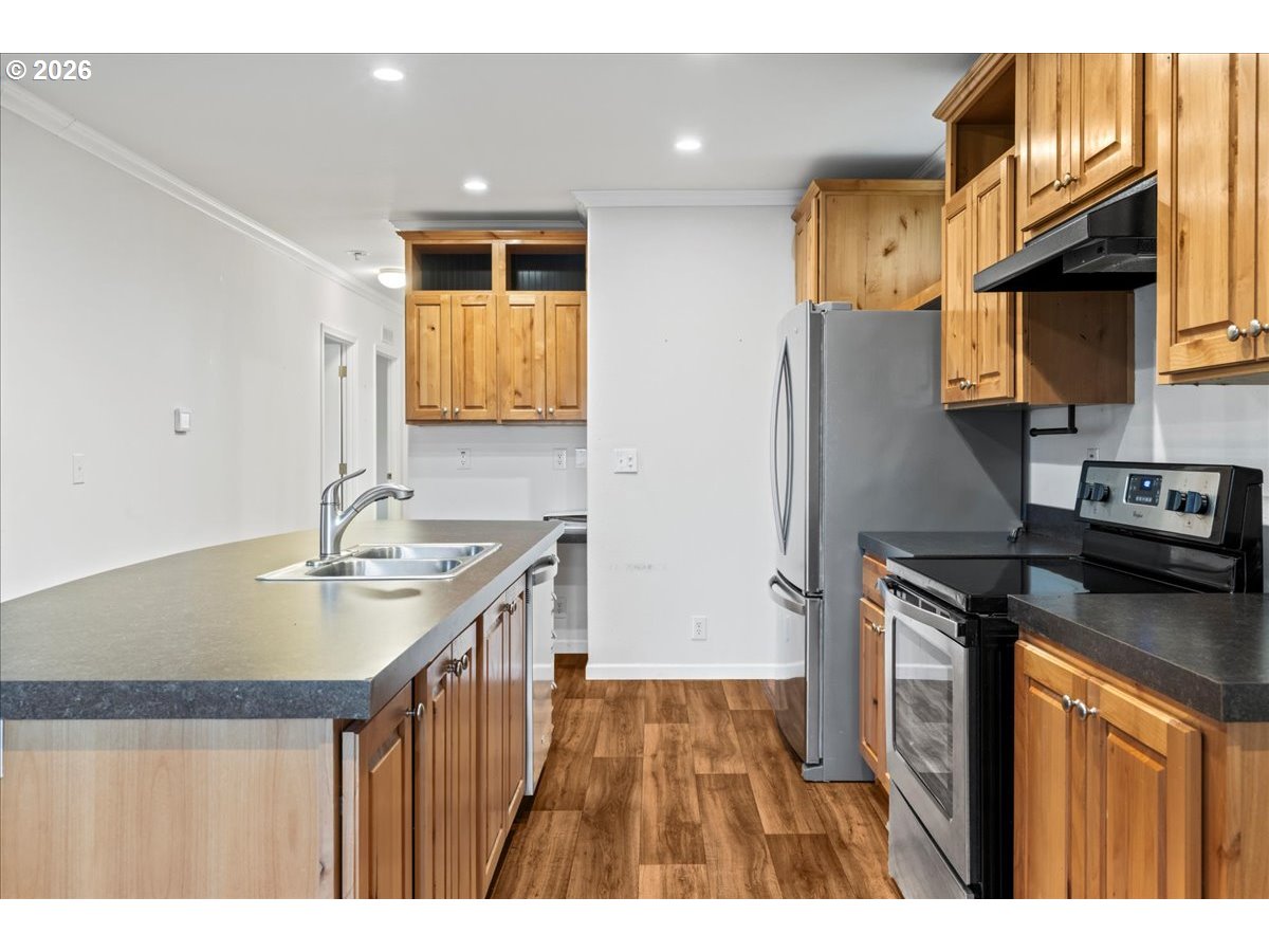 7136 South King Street Canby, OR 97013 - Photo 14 of 31 a kitchen with a sink stove and refrigerator