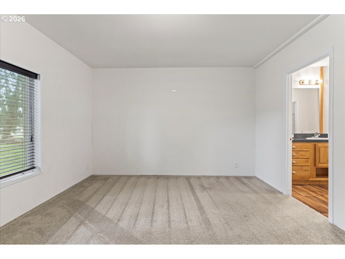 7136 South King Street Canby, OR 97013 - Photo 25 of 31 a view of wooden floor and windows in a room