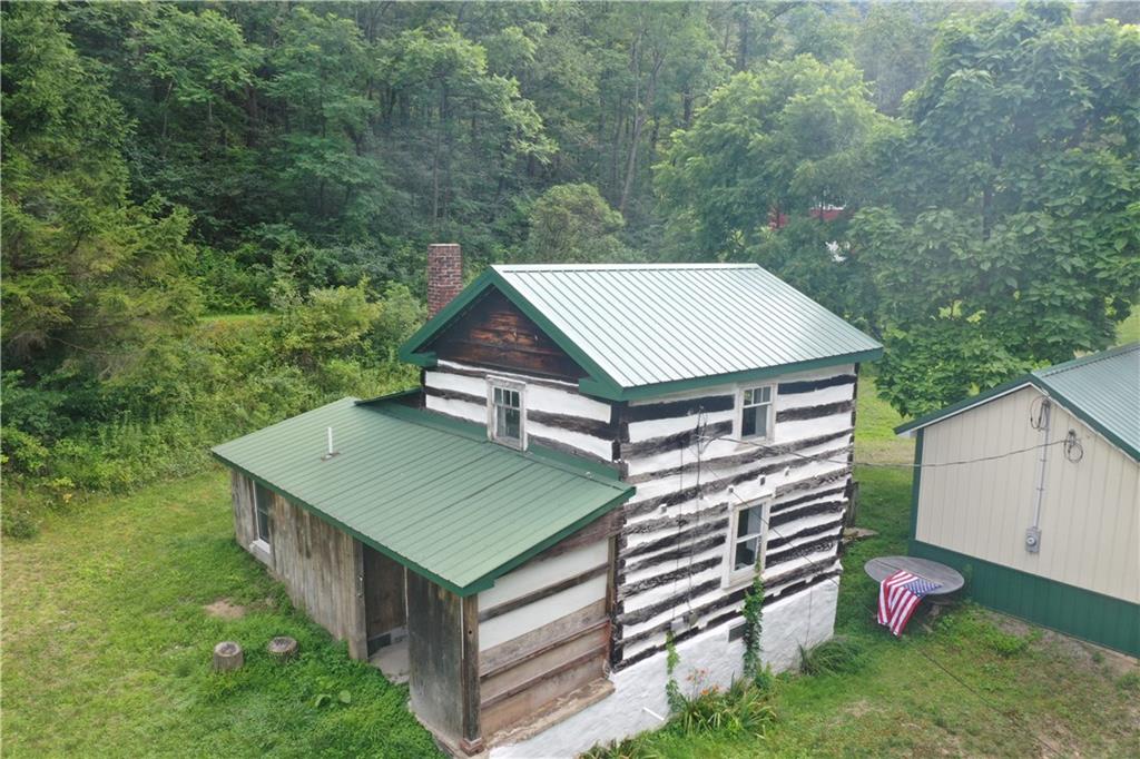 457 Grasser Road Manns Choice, PA 15550 - Photo 1 of 36 an aerial view of a house