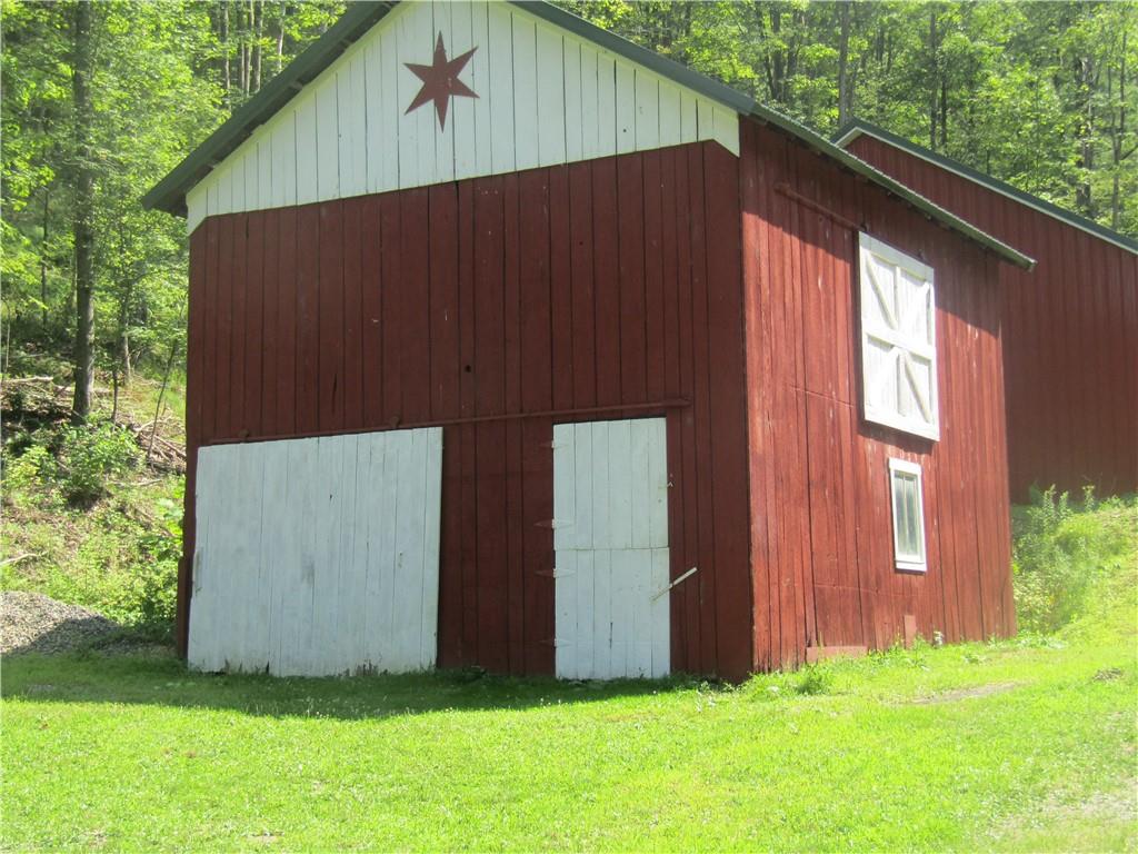 457 Grasser Road Manns Choice, PA 15550 - Photo 12 of 36 a backyard of a house